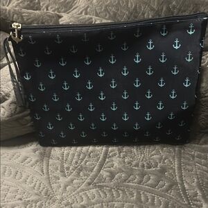 Tommy Bahama teal and navy Anchor Print Wristlet swimsuit bag